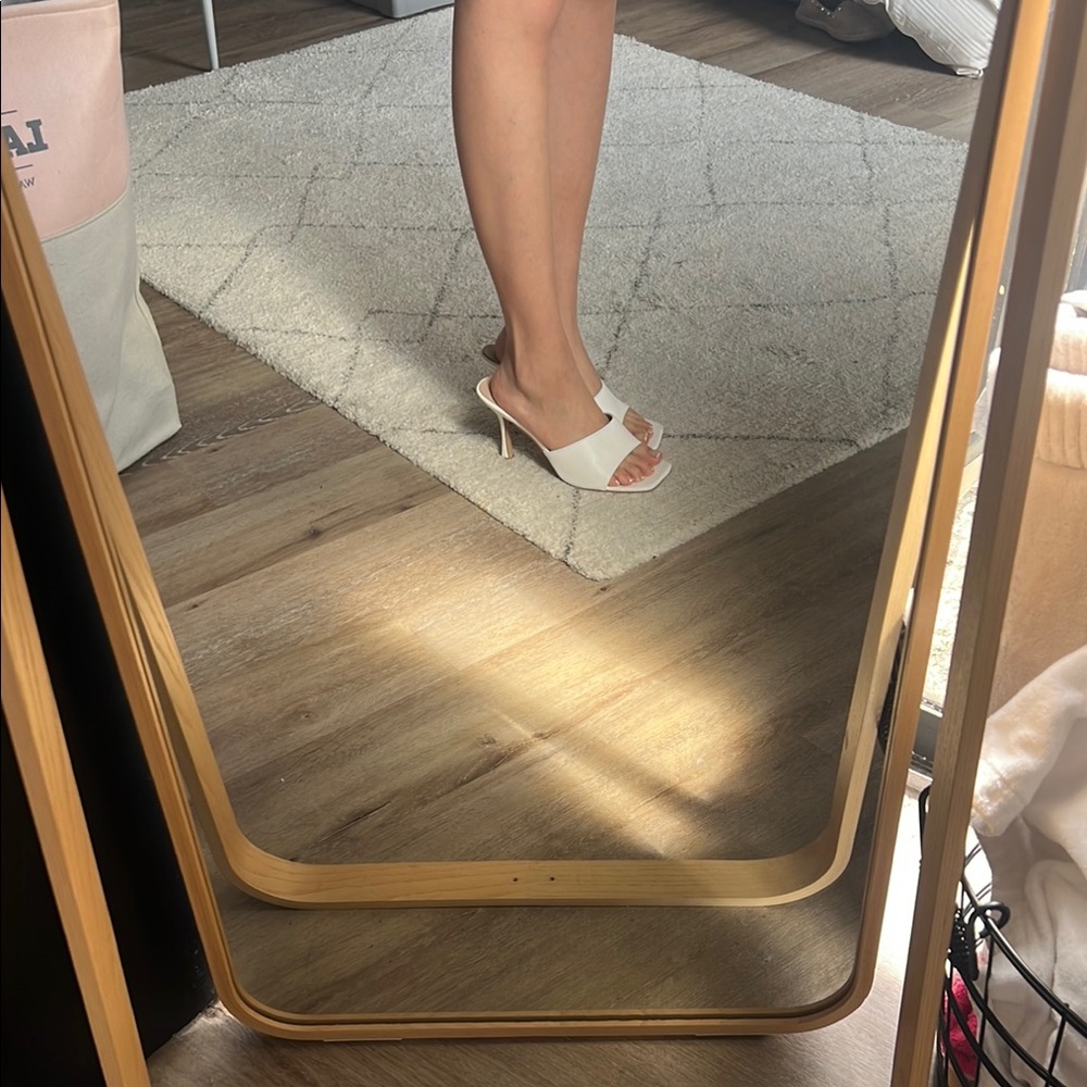 Elegant White Heeled Mules.